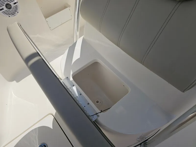 Slide: The Image of Interior of Key West 239 FS boat, seating area with storage. - 18