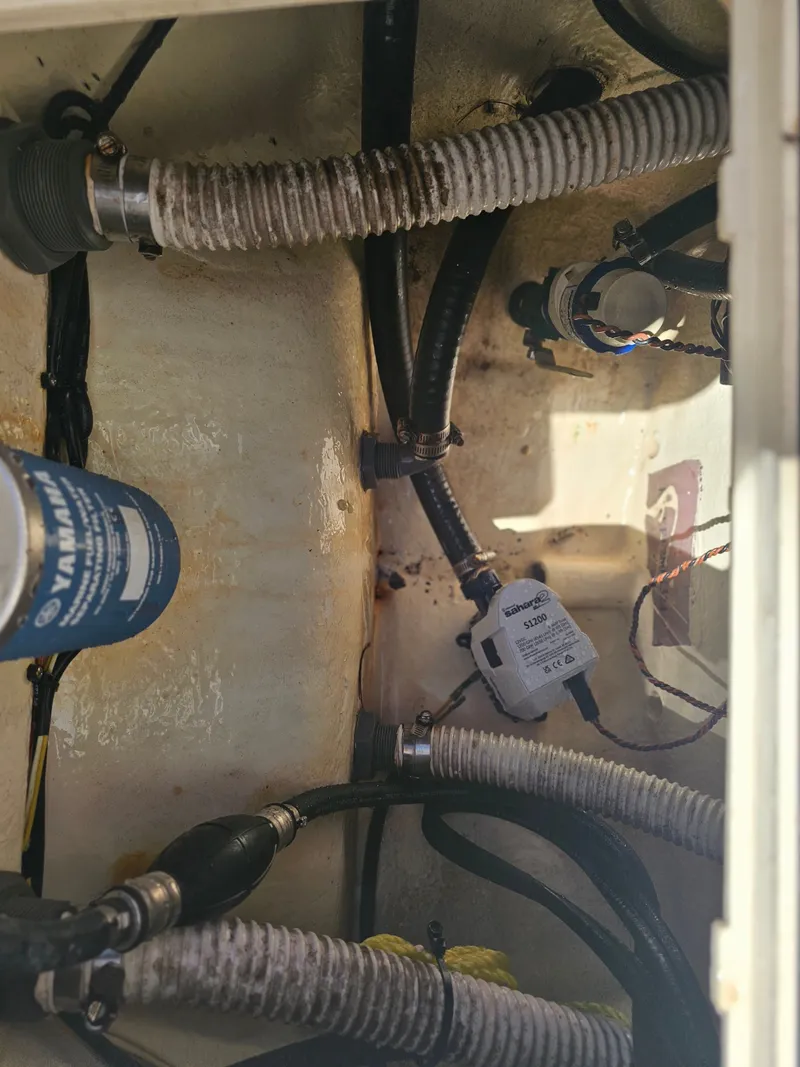 Slide: The Image of Interior view of 2024 Key West 239 FS boat engine compartment. - 29