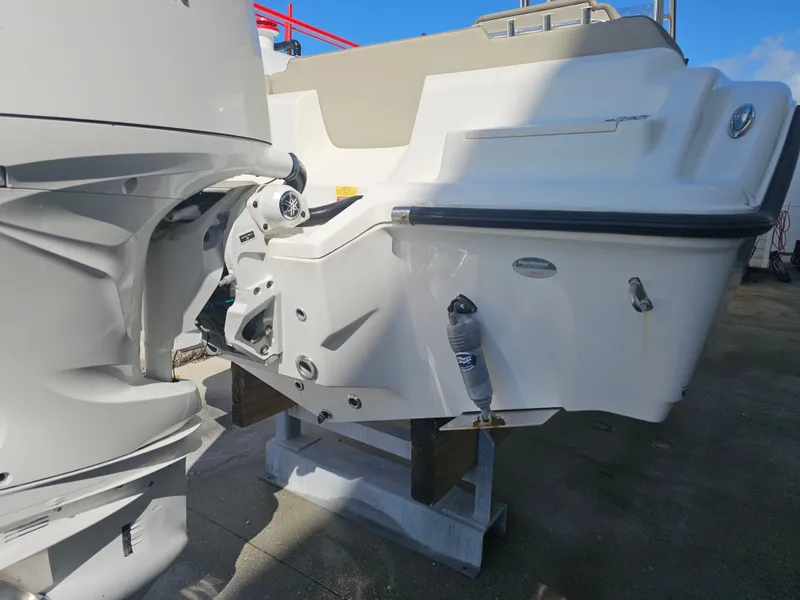 Slide: The Image of Rear view of a 2024 Key West 239 FS boat with outboard motor. - 5