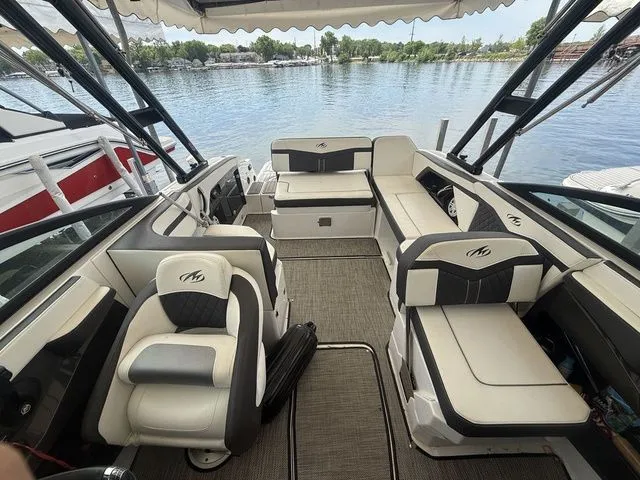 Slide: The Image of Interior of a 2019 Monterey 258SS Super Sport boat by the water. - 10
