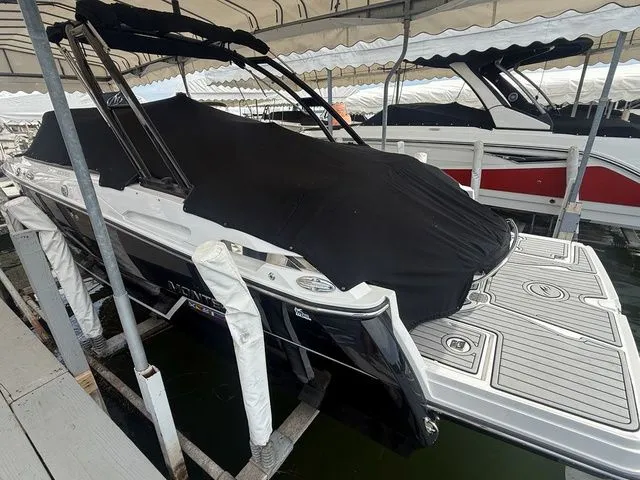 Slide: The Image of 2019 Monterey 258SS Super Sport boat with cover in dock. - 15