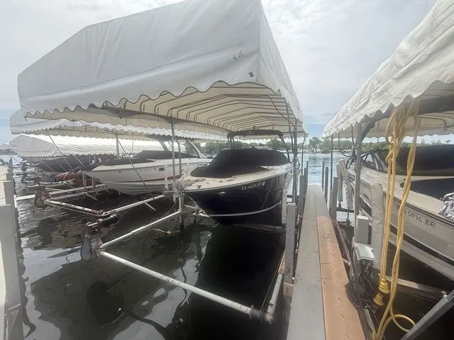 Slide: The Image of 2019 Monterey 258SS Super Sport boat docked under canopy. - 3