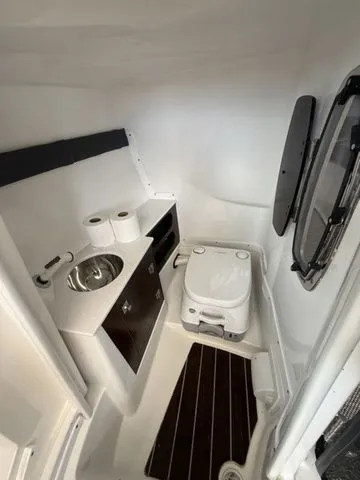 Slide: The Image of Interior of 2019 Monterey 258SS Super Sport with toilet and sink. - 7