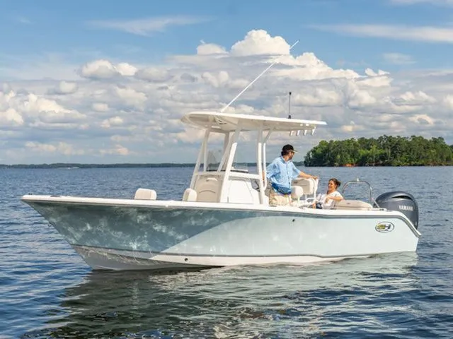 Slide: The Image of 2026 Sea Hunt Ultra 229 boat on calm waters. - 6