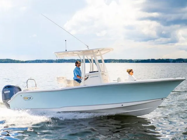 Slide: The Image of Sea Hunt Ultra 229 boat on calm water, 2026 model. - 8