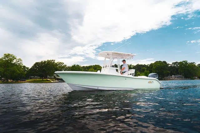 The Image of 2026 Sea Hunt Ultra 219 boat on calm water. - 1