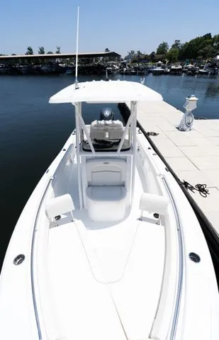 Slide: The Image of Sea Hunt Ultra 219 boat, 2026 model, docked at marina. - 2