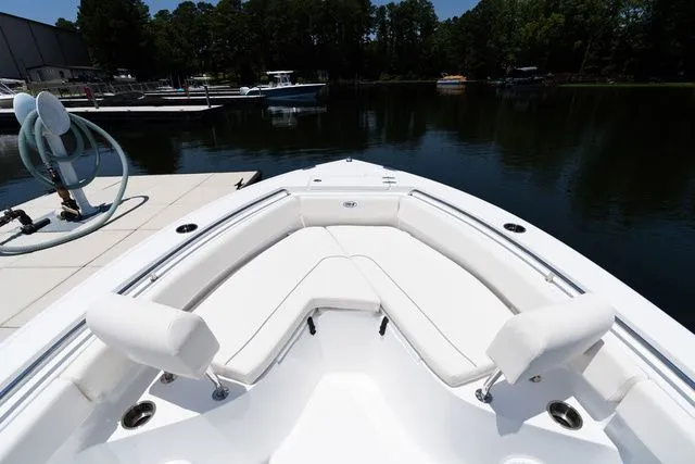 Slide: The Image of Interior view of Sea Hunt Ultra 219 boat, 2026 model, at dock. - 5