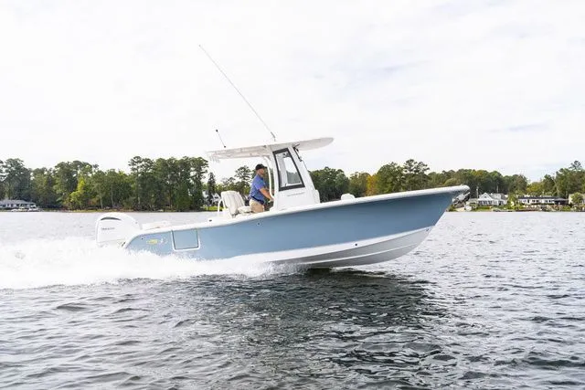 The Image of 2026 Sea Hunt Ultra 245 SE boat on a lake. - 1
