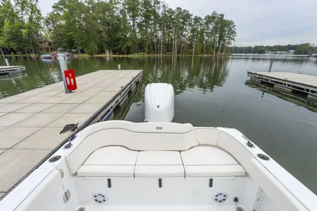 Slide: The Image of Interior view of Sea Hunt Ultra 245 SE boat at dock, 2026 model. - 8