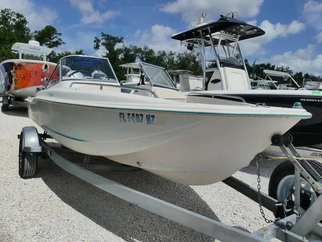 The Image of 1998 Scout 172 Dorado boat on trailer, sunny day. - 1