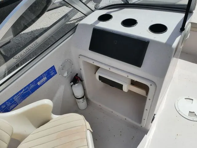 Slide: The Image of Interior view of a 1998 Scout 172 Dorado boat with helm console. - 10