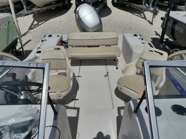 Slide: The Image of Interior of a 1998 Scout 172 Dorado boat with seating. - 13
