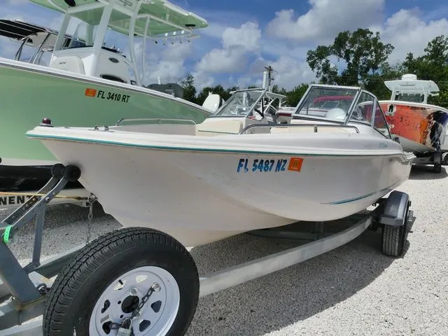 Slide: The Image of 1998 Scout 172 Dorado boat on trailer, sunny day. - 2
