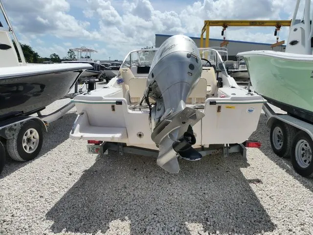 Slide: The Image of Rear view of a 1998 Scout 172 Dorado boat with outboard motor. - 5