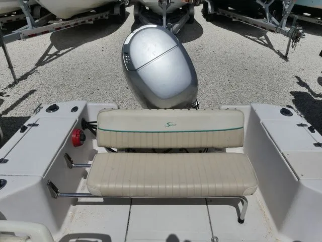Slide: The Image of Rear view of a 1998 Scout 172 Dorado boat with outboard motor. - 7