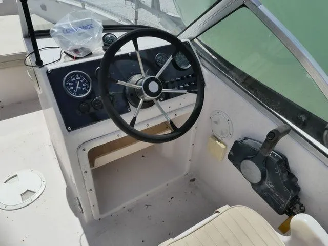 Slide: The Image of Interior view of a 1998 Scout 172 Dorado boat cockpit. - 8