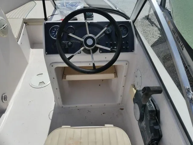 Slide: The Image of Interior view of a 1998 Scout 172 Dorado boat cockpit. - 9