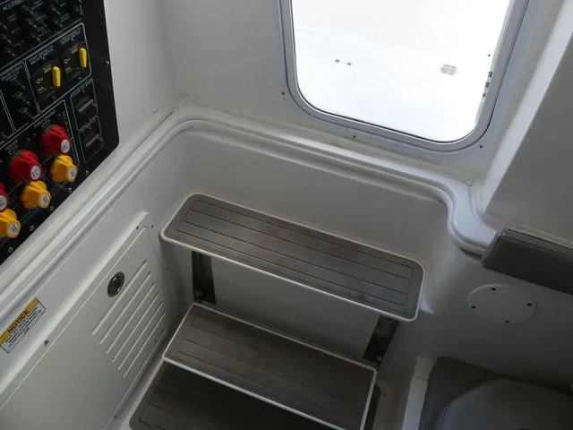 Slide: The Image of Interior of 2021 Sea Fox 328 Commander with steps and control panel. - 28