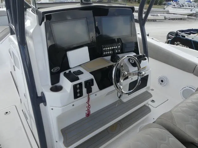 Slide: The Image of 2021 Sea Fox 328 Commander helm with modern controls and displays. - 33