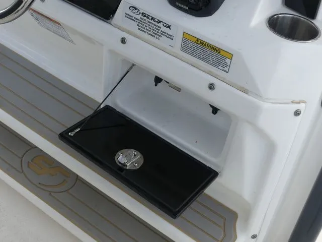 Slide: The Image of Sea Fox 328 Commander 2021, helm console with storage compartment. - 40