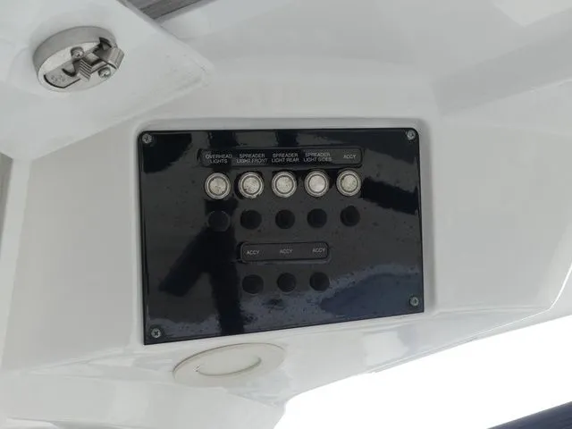 Slide: The Image of Control panel of Sea Fox 328 Commander 2021 with various switches. - 42