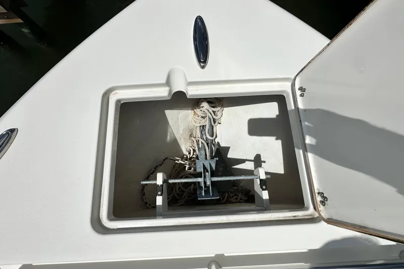 Slide: The Image of Anchor storage compartment on a 2021 Cobia 240 Center Console boat. - 12