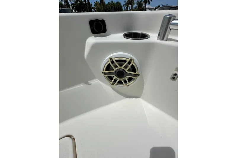 Slide: The Image of Speaker and cup holder on 2021 Cobia 240 Center Console boat. - 16