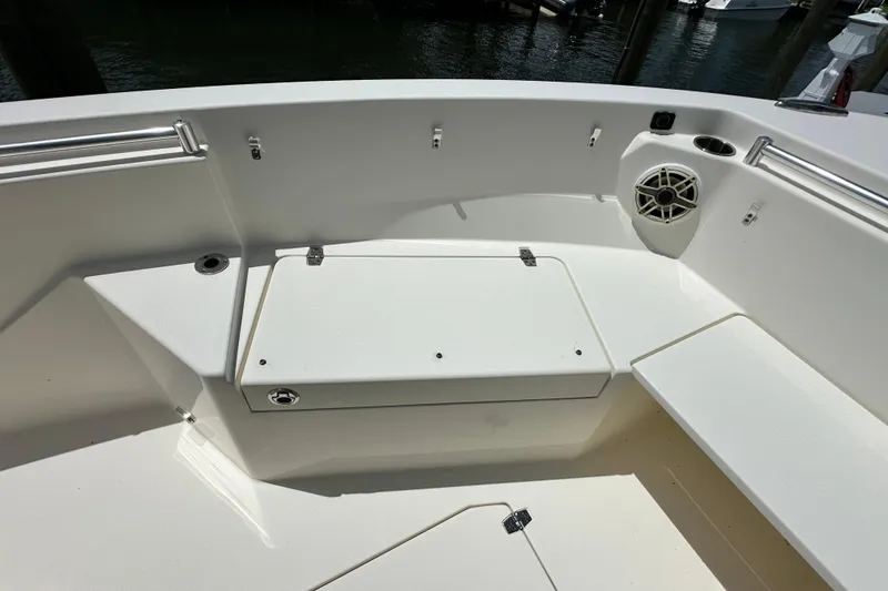Slide: The Image of 2021 Cobia 240 Center Console boat interior with seating and storage compartments. - 17