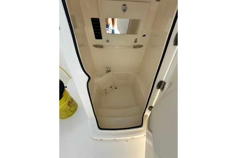 Slide: The Image of Interior view of 2021 Cobia 240 Center Console boat's storage compartment. - 32