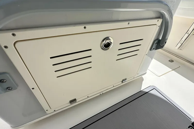 Slide: The Image of Storage compartment on a 2021 Cobia 240 Center Console boat. - 56
