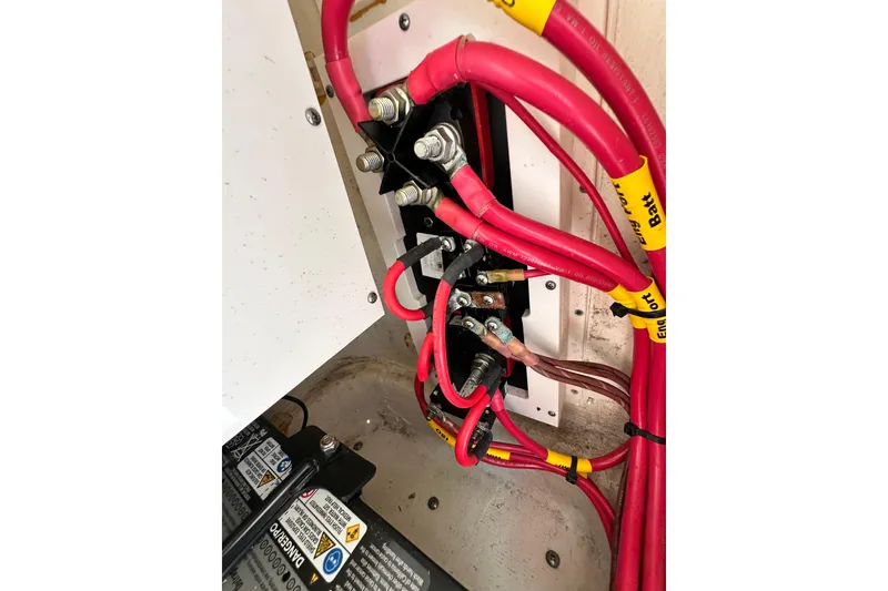 Slide: The Image of Electrical wiring and battery setup in a 2021 Cobia 240 Center Console boat. - 59
