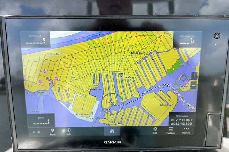 Slide: The Image of Garmin GPS display on a 2021 Cobia 240 Center Console, showing Holmes Beach navigation map. - 68
