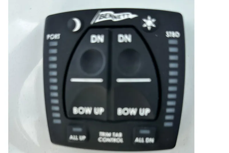 Slide: The Image of Bennett trim tab control panel on 2021 Cobia 240 Center Console boat. - 72