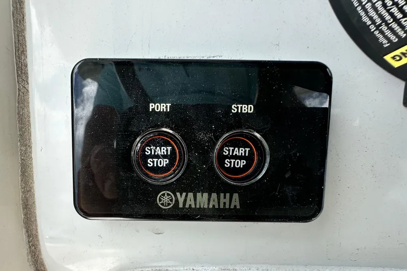 Slide: The Image of Yamaha start-stop panel on 2021 Cobia 240 Center Console boat. - 73