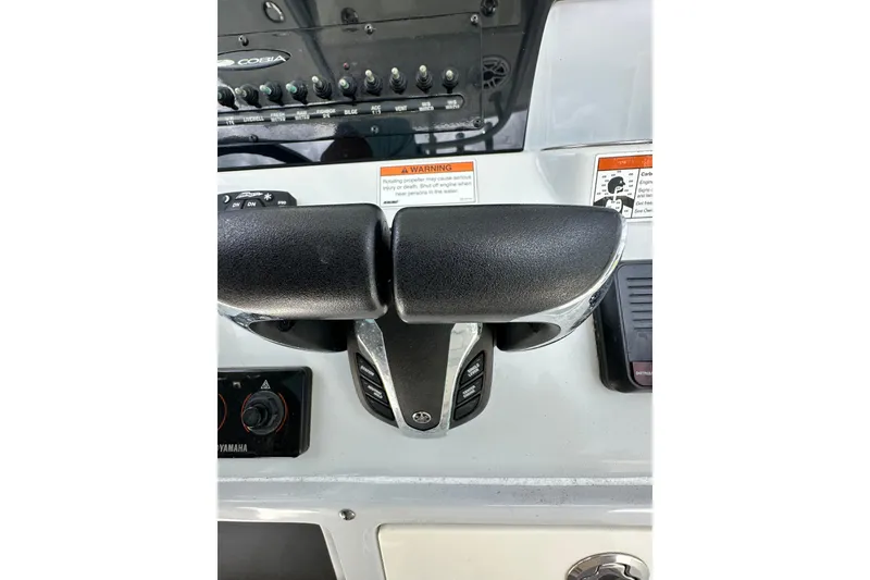 Slide: The Image of 2021 Cobia 240 Center Console boat controls and dashboard close-up. - 75