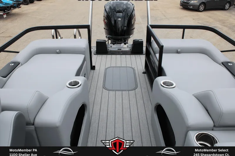 Slide: The Image of 2026 SunCatcher Fusion 324SS boat interior with gray seating and outboard motor. - 10