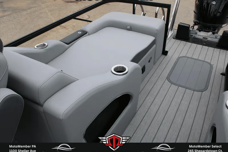 Slide: The Image of 2026 SunCatcher Fusion 324SS boat interior with gray seating and cup holders. - 11