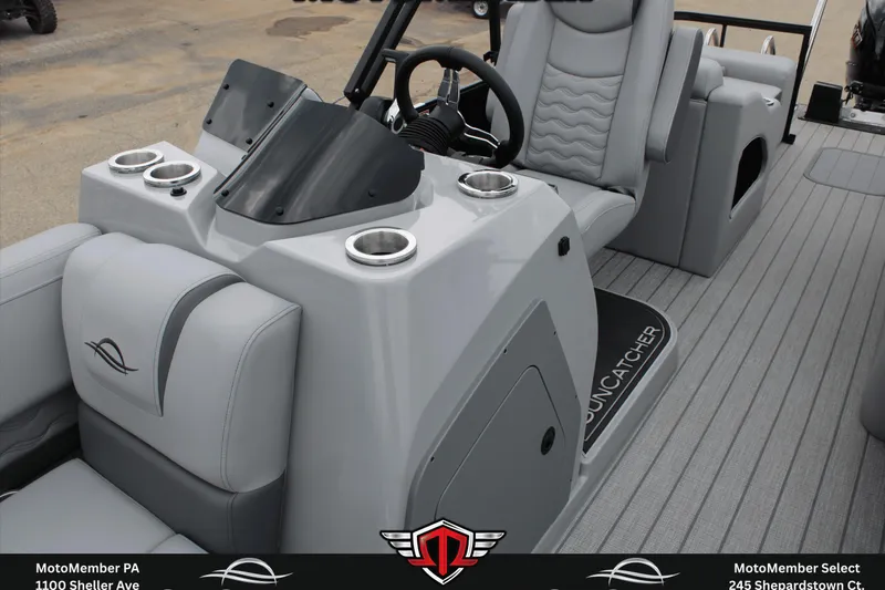Slide: The Image of 2026 SunCatcher Fusion 324SS boat interior with sleek gray seating and modern dashboard design. - 18
