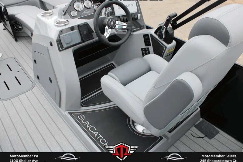 Slide: The Image of 2026 SunCatcher Fusion 324SS boat interior with modern steering console and comfortable seating. - 19