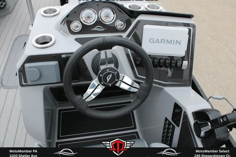 Slide: The Image of 2026 SunCatcher Fusion 324SS boat dashboard with Garmin navigation system and modern controls. - 20