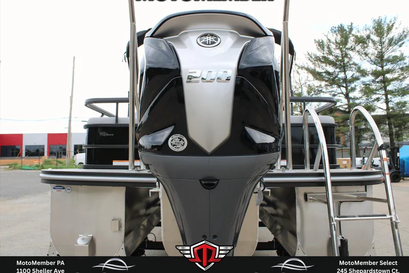 Slide: The Image of 2026 SunCatcher Fusion 324SS boat with powerful 200 HP engine, showcased at dealership. - 24