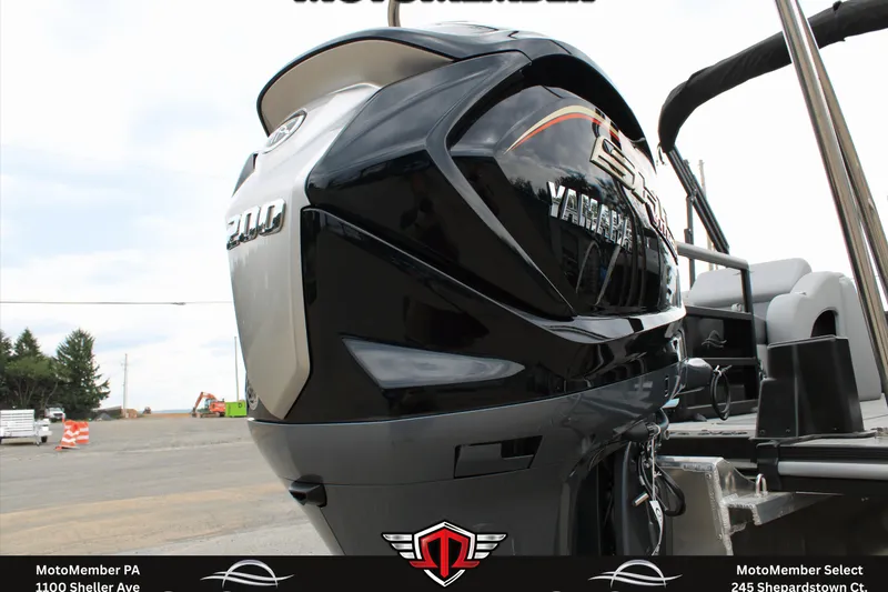 Slide: The Image of 2026 SunCatcher Fusion 324SS boat with Yamaha 200 engine, displayed outdoors. - 25