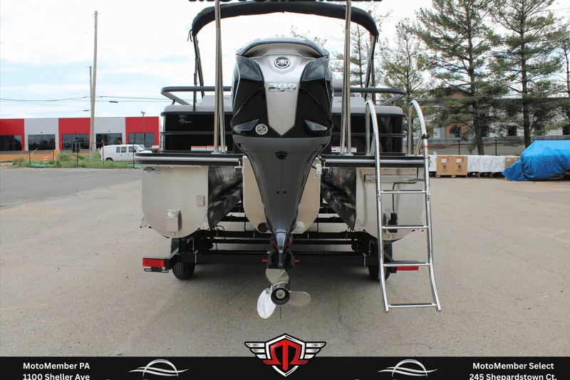 Slide: The Image of 2026 SunCatcher Fusion 324SS pontoon boat rear view with motor and ladder. - 5
