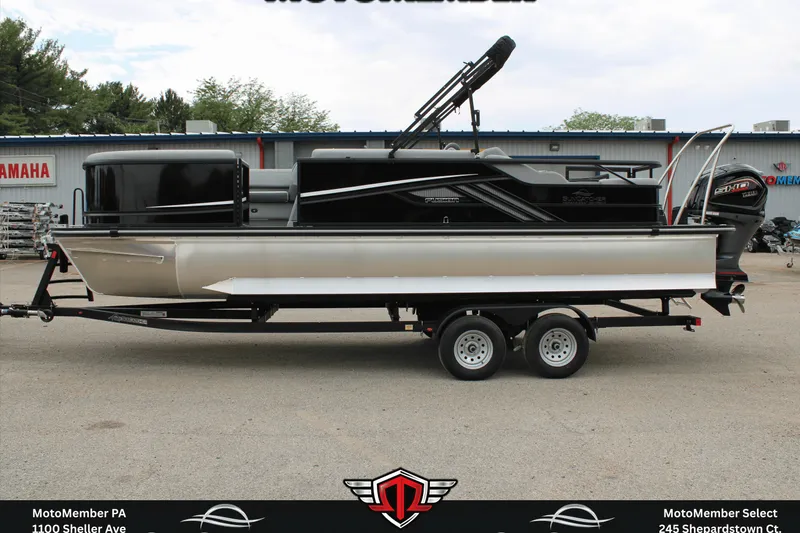 Slide: The Image of 2026 SunCatcher Fusion 324SS pontoon boat on trailer, parked outside dealership. - 7