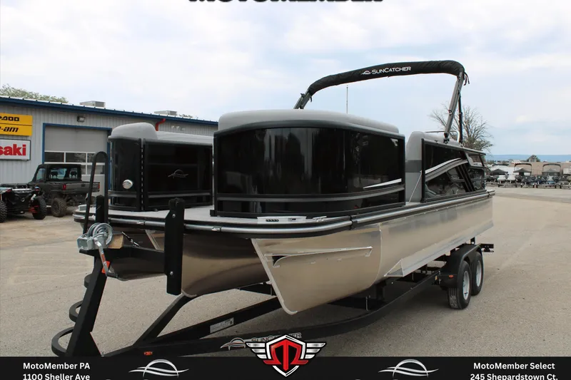 Slide: The Image of 2026 SunCatcher Fusion 324SS pontoon boat on trailer at dealership. - 8