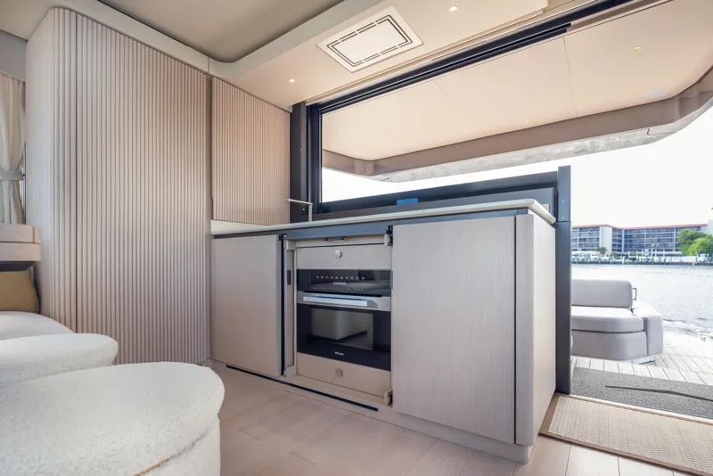 Slide: The Image of Luxurious interior of 2025 Azimut Seadeck 6 yacht with modern kitchen and waterfront view. - 10
