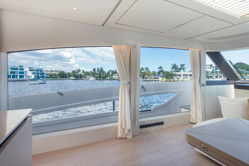 Slide: The Image of Luxurious interior view of 2025 Azimut Seadeck 6 yacht with scenic waterfront. - 11