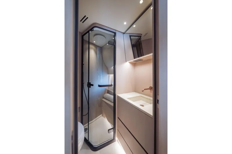Slide: The Image of Luxurious bathroom interior of 2025 Azimut Seadeck 6 yacht, featuring modern shower and sink. - 22
