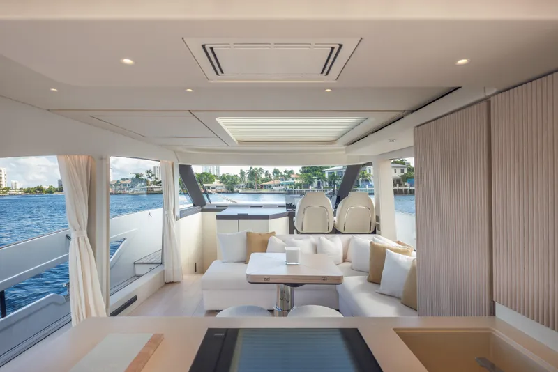 Slide: The Image of Luxurious interior of 2025 Azimut Seadeck 6 yacht with elegant seating and scenic water views. - 7